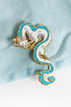 Load image into Gallery viewer, Haku from Spirited Away in enamel pin form! He is cast in gold metal with teal glitter in his mane and tail.