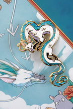 Load image into Gallery viewer, Haku from Spirited Away in enamel pin form! He is cast in gold metal with teal glitter in his mane and tail.