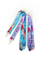 Load image into Gallery viewer, Laying in Flowers with Butterflies Lanyard