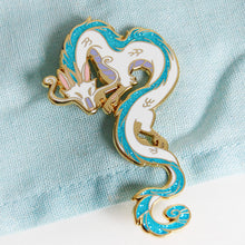 Load image into Gallery viewer, Haku from Spirited Away in enamel pin form! He is cast in gold metal with teal glitter in his mane and tail.
